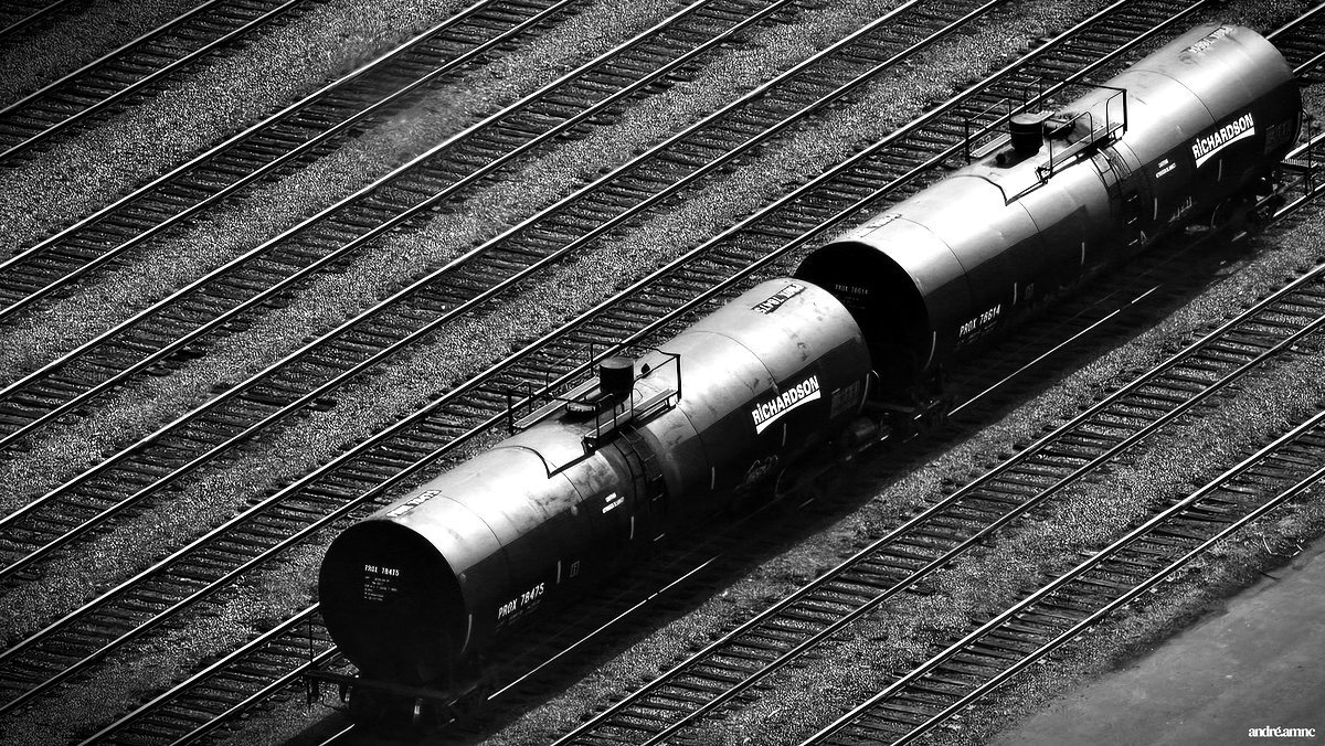 Two tank cars on a rail yard, seen from above
